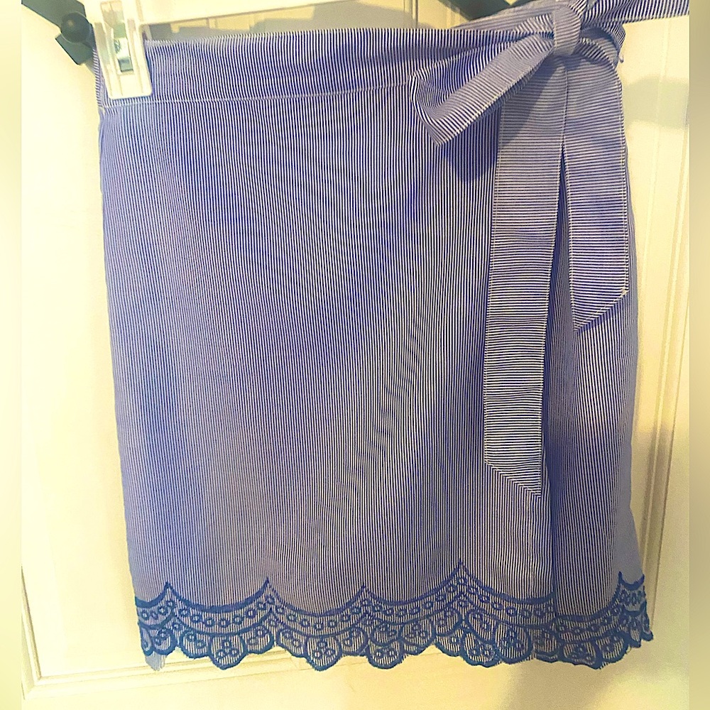 Women’s wrap skirt, striped and embroidered on the bottom